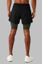 black and green shorts back