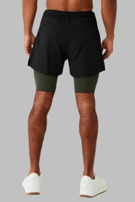 black and green shorts back